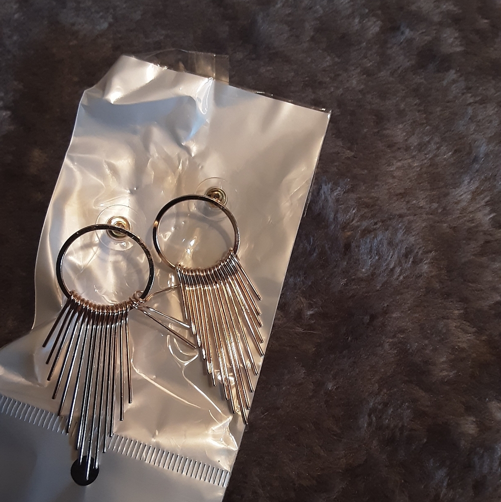 Gold toned dangle hoop earrings